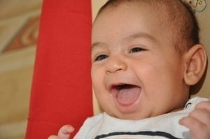 Navajo baby laughing as part of Navajo First Laugh Ceremony. 