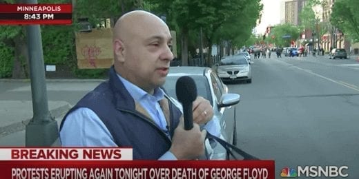 Journalist Ali Velshi coughs after tear gassing by Minneapolis police.
