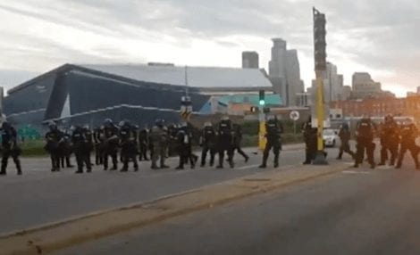 Minneapolis state troopers shoot rubber bullets at car full of journalists as they drive away.