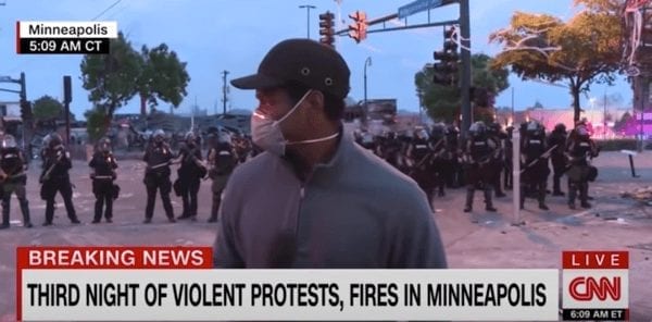 Journalist Omar Jimenez with CNN reports on MN police activity.