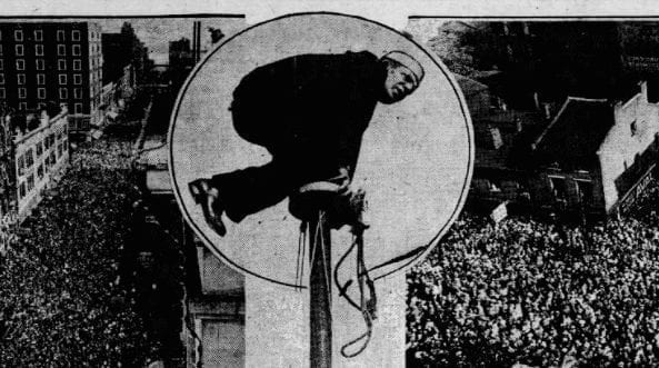 Shipwreck Kelly performs a flagpole sitting in Louisville