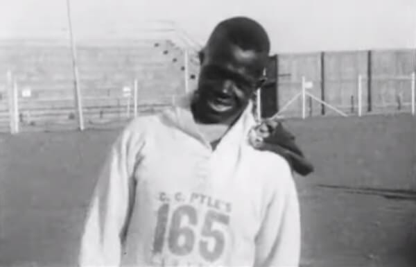 Edward Gardner appears on camera ahead of the Bunion Derby race wearing number 165.