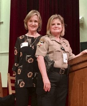 Ellen Halbert with Travis County Sheriff Sally Hernandez