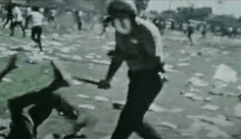 Cop in riot gear beats Chicano protester with baton